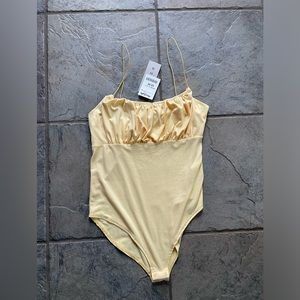 NWT Yellow body suit!